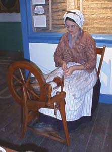 Member Kelly Milspaugh demonstrated spinning wool into yarn